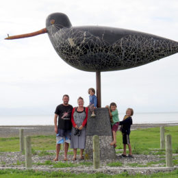 Scott, Helen, Jay, Zef and Ollie pose with the godwit sculpture on the Miranda coast, Firth of Thames, May 2016. Photograph by Scott Brooks